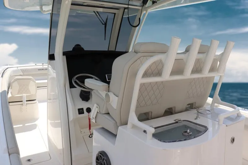 Slide: The Image of Manufacturer Provided Image: 2026 World Cat 280 CC-X boat interior with helm, seating, and ocean view. - 11