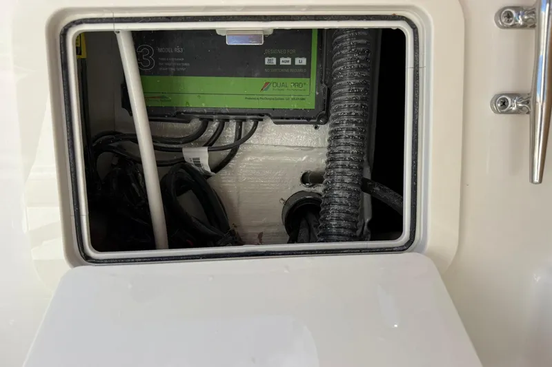 Slide: The Image of Electrical compartment of 2026 World Cat 280 CC-X boat, featuring wiring and components. - 14