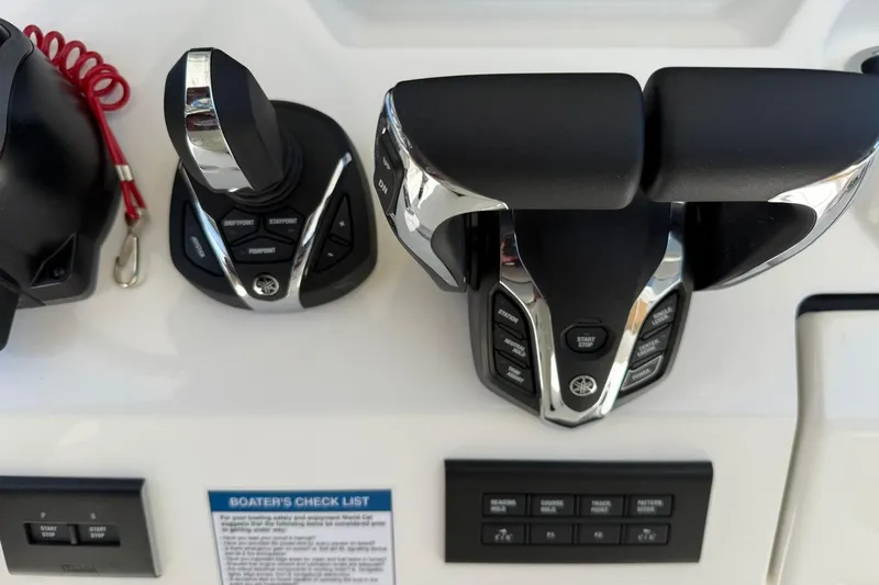 Slide: The Image of 2026 World Cat 280 CC-X boat controls with joystick and throttle levers. - 16