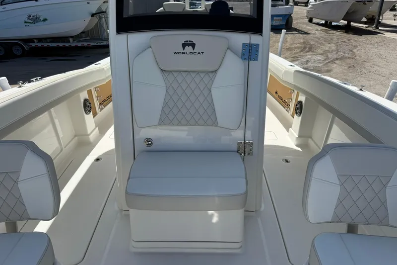 Slide: The Image of 2026 World Cat 280 CC-X boat interior with white seating and diamond stitching. - 19