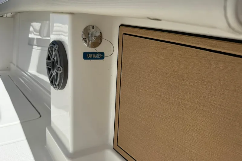 Slide: The Image of 2026 World Cat 280 CC-X boat interior with speaker and raw water access. - 24