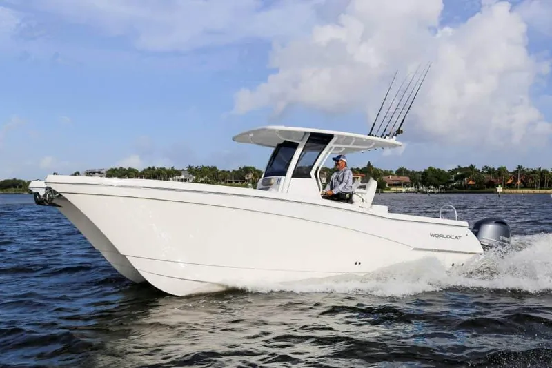 Slide: The Image of Manufacturer Provided Image: 2026 World Cat 280 CC-X cruising on open water under a clear sky. - 3