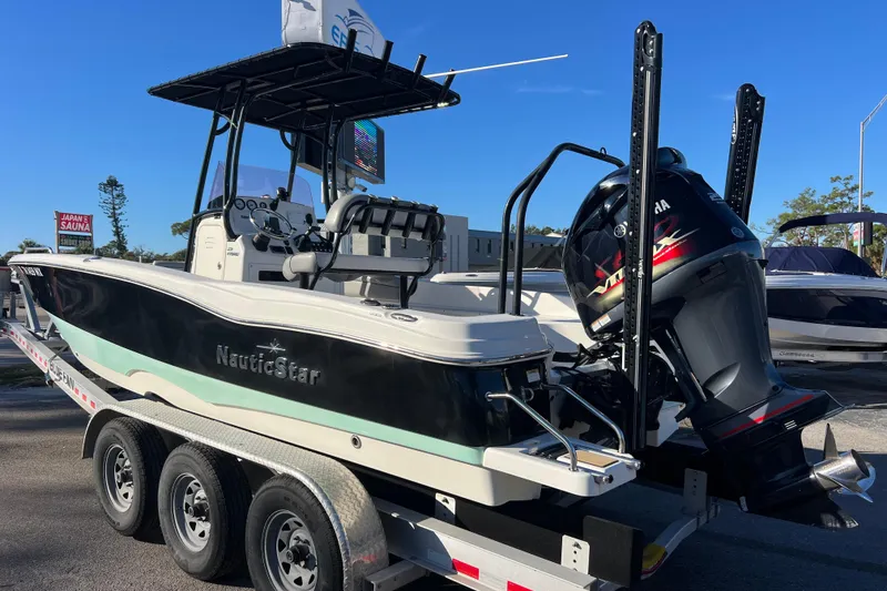 Slide: The Image of 2021 NauticStar 231 Hybrid boat on trailer with Yamaha outboard motor. - 3