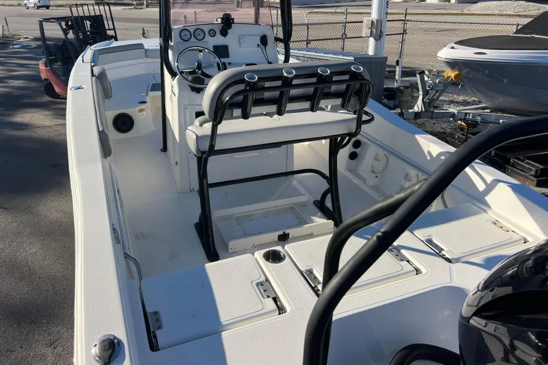 Slide: The Image of 2021 NauticStar 231 Hybrid boat interior with seating and control panel. - 5
