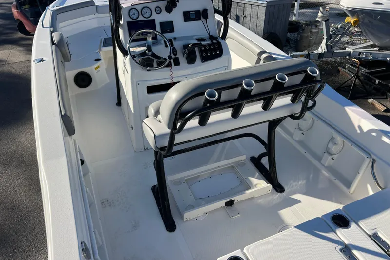 Slide: The Image of 2021 NauticStar 231 Hybrid boat interior with steering console and seating. - 6