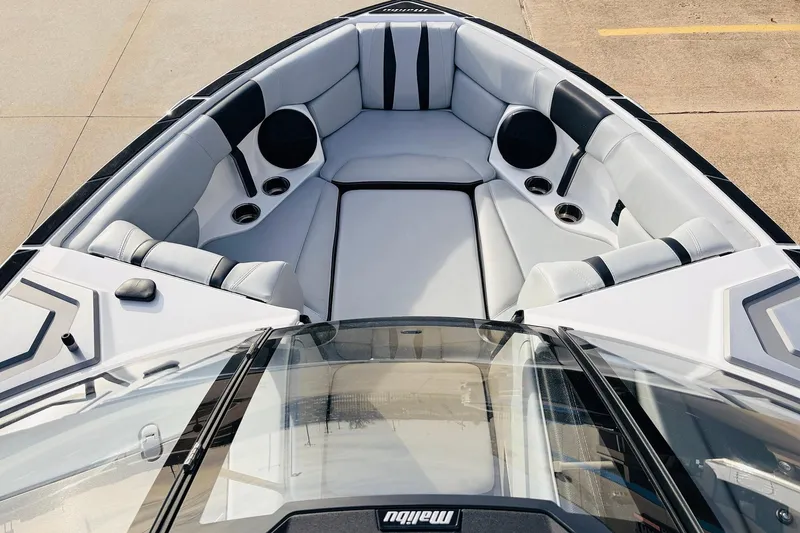 Slide: The Image of 2024 Malibu Wakesetter 22 LSV boat interior with sleek seating and cup holders. - 12