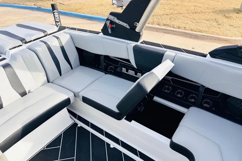 Slide: The Image of 2024 Malibu Wakesetter 22 LSV interior with sleek, modern seating and storage compartments. - 19