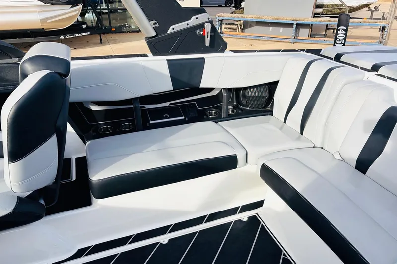 Slide: The Image of 2024 Malibu Wakesetter 22 LSV interior with sleek black and white seating design. - 24