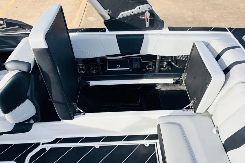 Slide: The Image of 2024 Malibu Wakesetter 22 LSV interior seating with sleek black and white design. - 25