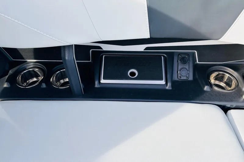 Slide: The Image of 2024 Malibu Wakesetter 22 LSV interior with cup holders and control panel. - 26