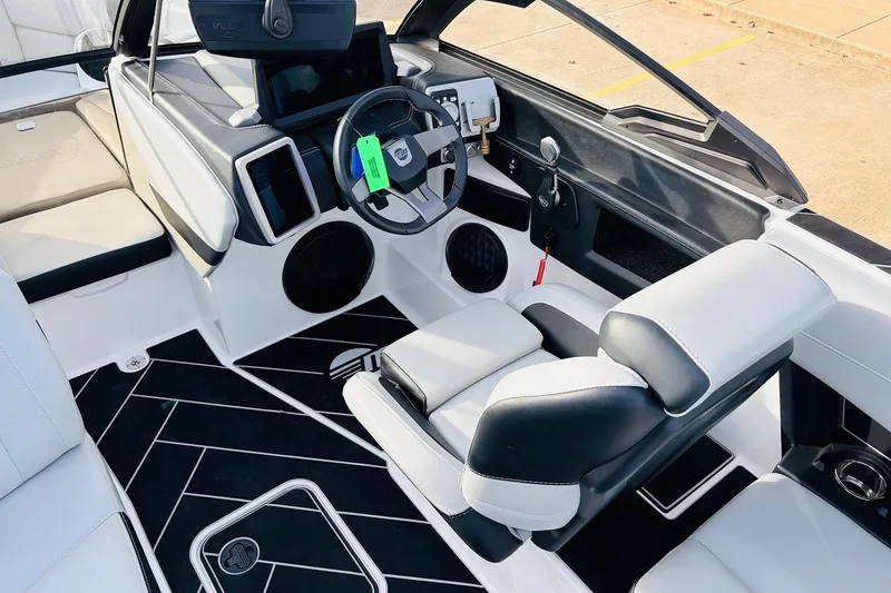 Slide: The Image of 2024 Malibu Wakesetter 22 LSV interior with modern dashboard and seating. - 27