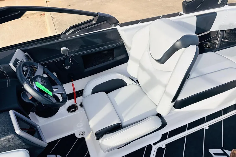 Slide: The Image of 2024 Malibu Wakesetter 22 LSV interior with sleek white and black seating. - 28