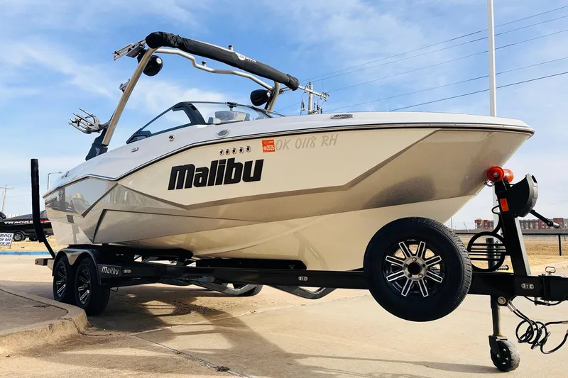 Slide: The Image of 2024 Malibu Wakesetter 22 LSV boat on trailer, displayed outdoors. - 3