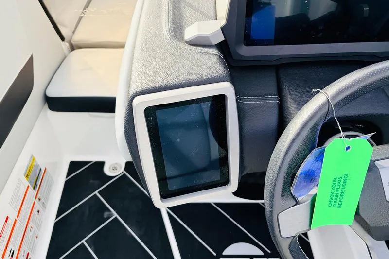 Slide: The Image of 2024 Malibu Wakesetter 22 LSV dashboard with touchscreen and steering wheel detail. - 31