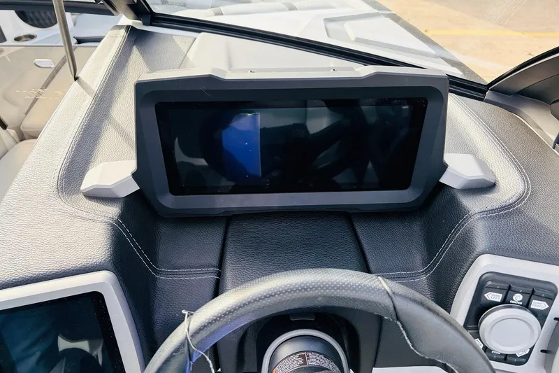 Slide: The Image of Dashboard of 2024 Malibu Wakesetter 22 LSV with touchscreen display and controls. - 32