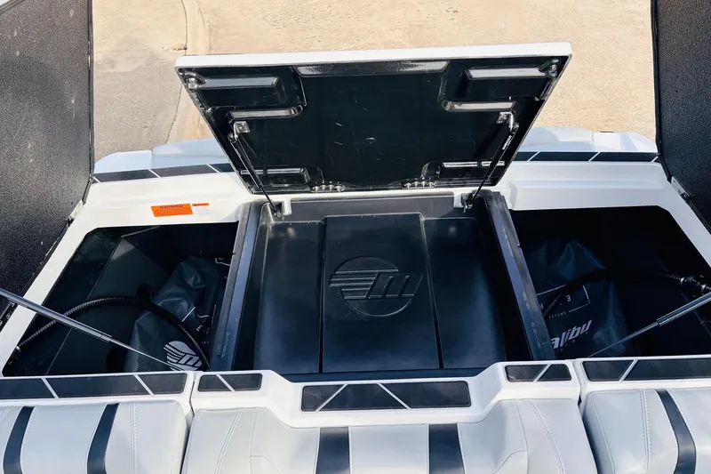 Slide: The Image of 2024 Malibu Wakesetter 22 LSV storage compartments with open hatches, showcasing interior design. - 39