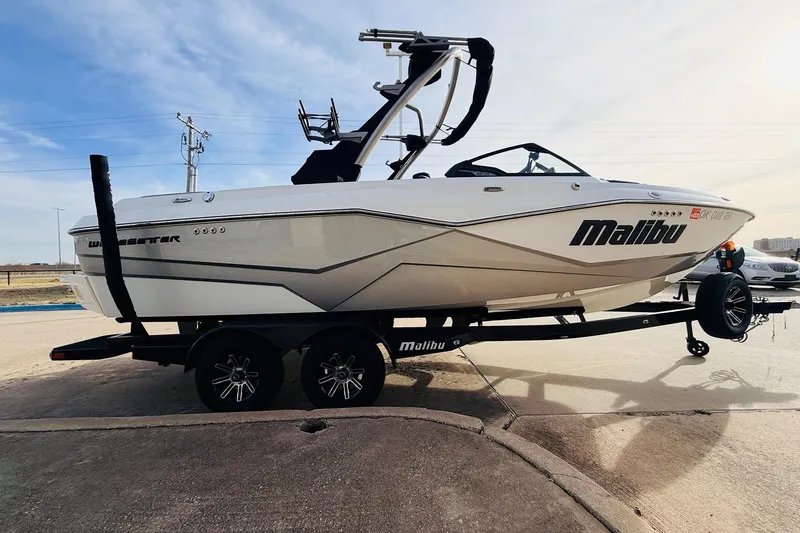 Slide: The Image of 2024 Malibu Wakesetter 22 LSV boat on trailer, side view, outdoors. - 4