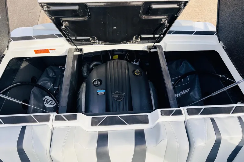 Slide: The Image of 2024 Malibu Wakesetter 22 LSV engine compartment with open hatch, showcasing powerful engine design. - 41