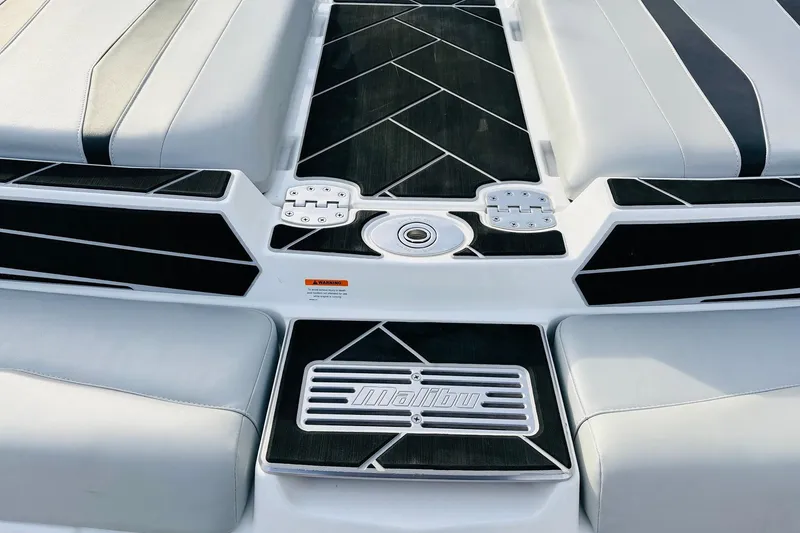 Slide: The Image of 2024 Malibu Wakesetter 22 LSV boat interior with sleek black and white design. - 43