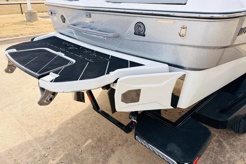 Slide: The Image of 2024 Malibu Wakesetter 22 LSV rear view with swim platform and surf gate. - 46