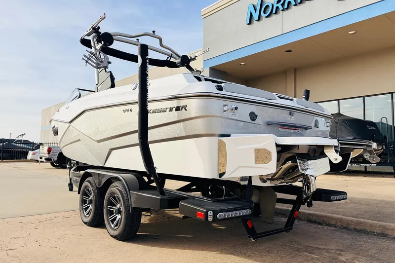 Slide: The Image of 2024 Malibu Wakesetter 22 LSV boat on trailer outside dealership. - 7