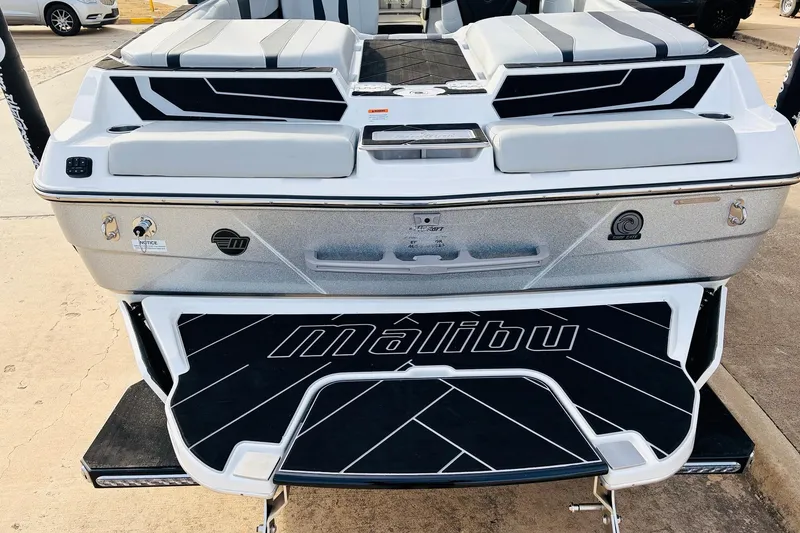 Slide: The Image of 2024 Malibu Wakesetter 22 LSV boat rear view, featuring sleek design and branding. - 8