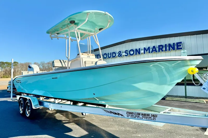 The Image of 2026 Carolina Skiff 26 Ultra Elite boat on trailer at marine dealership. - 1