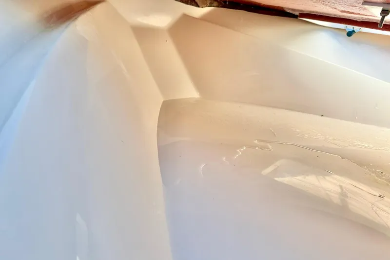 Slide: The Image of Close-up of 2026 Carolina Skiff 26 Ultra Elite boat hull, showcasing sleek design and glossy finish. - 20