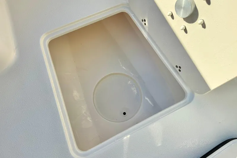 Slide: The Image of 2026 Carolina Skiff 26 Ultra Elite boat compartment, featuring a clean, white interior design. - 21