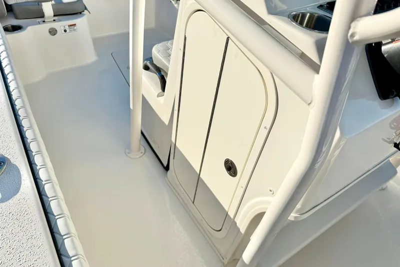 Slide: The Image of 2026 Carolina Skiff 26 Ultra Elite boat interior, featuring seating and storage compartments. - 27