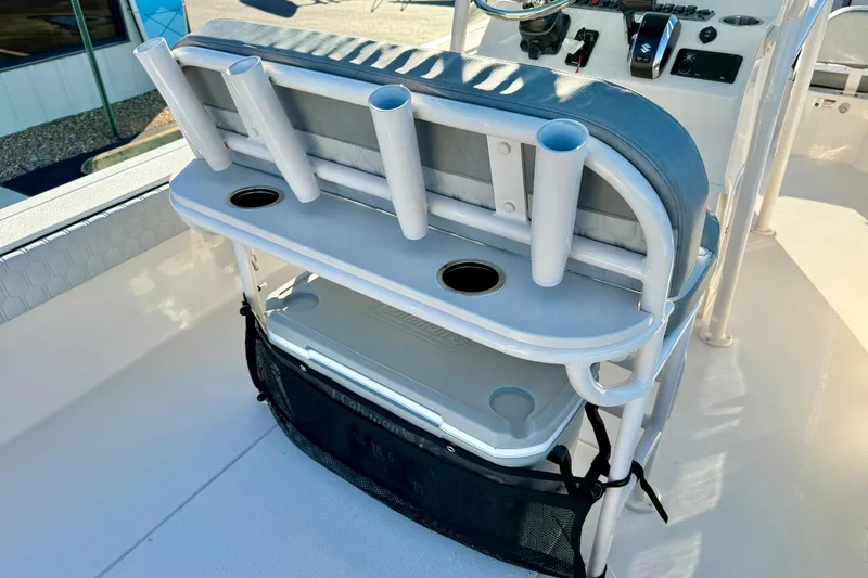 Slide: The Image of 2026 Carolina Skiff 26 Ultra Elite boat console with rod holders and storage. - 32