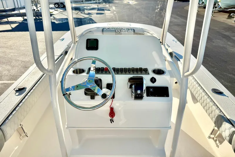 Slide: The Image of 2026 Carolina Skiff 26 Ultra Elite boat console with steering wheel and controls. - 33