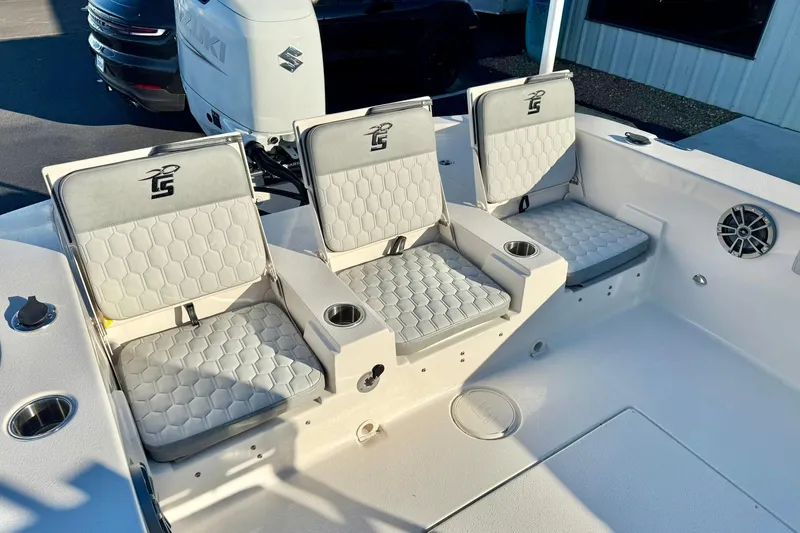 Slide: The Image of 2026 Carolina Skiff 26 Ultra Elite boat seating with cup holders and modern design. - 38
