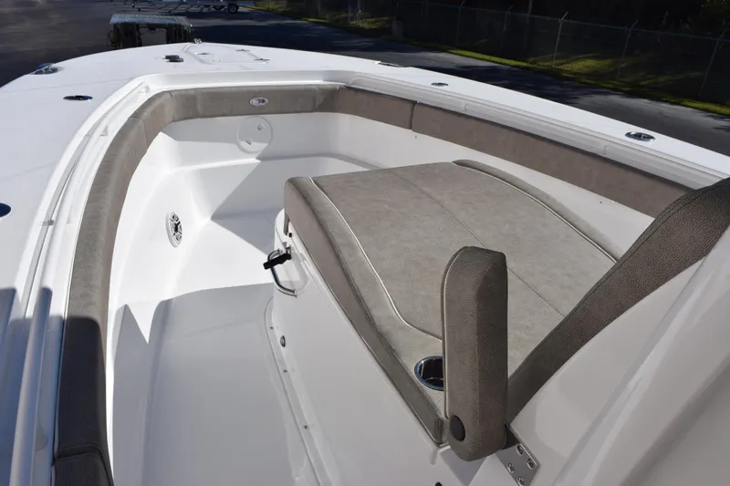 Slide: The Image of 2026 Sea Hunt Ultra 305 Coffin Box boat interior with cushioned seating. - 12