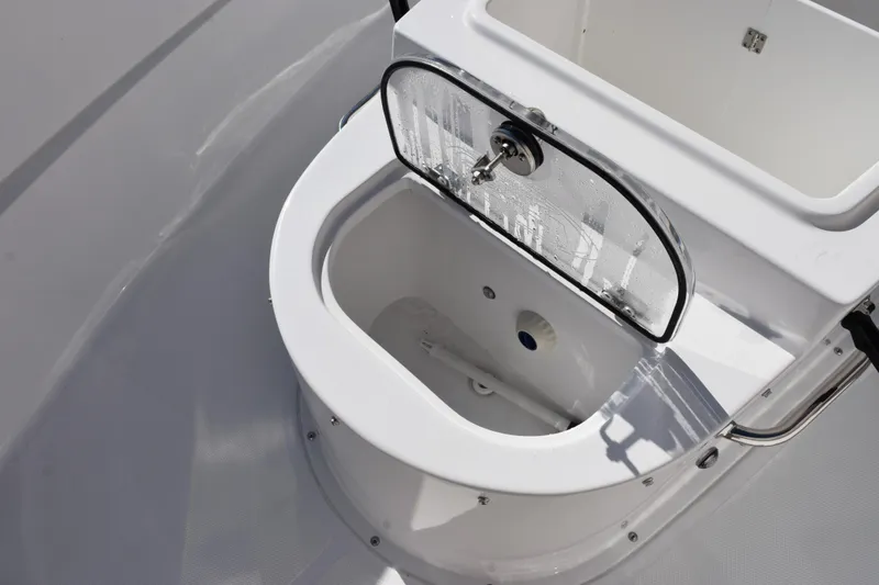 Slide: The Image of Livewell on 2026 Sea Hunt Ultra 305 Coffin Box boat, featuring a transparent lid. - 16