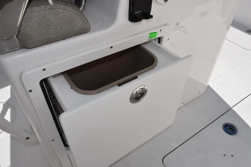 Slide: The Image of Storage compartment on 2026 Sea Hunt Ultra 305 Coffin Box boat, open drawer view. - 20