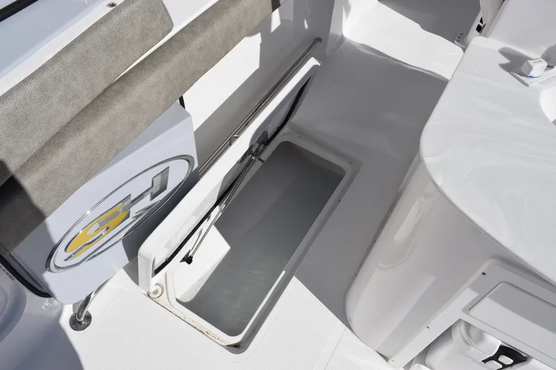 Slide: The Image of 2026 Sea Hunt Ultra 305 Coffin Box interior storage compartment, open and spacious design. - 22