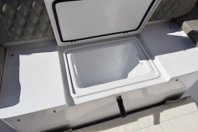 Slide: The Image of 2026 Sea Hunt Ultra 305 Coffin Box open, showcasing spacious storage compartment. - 25