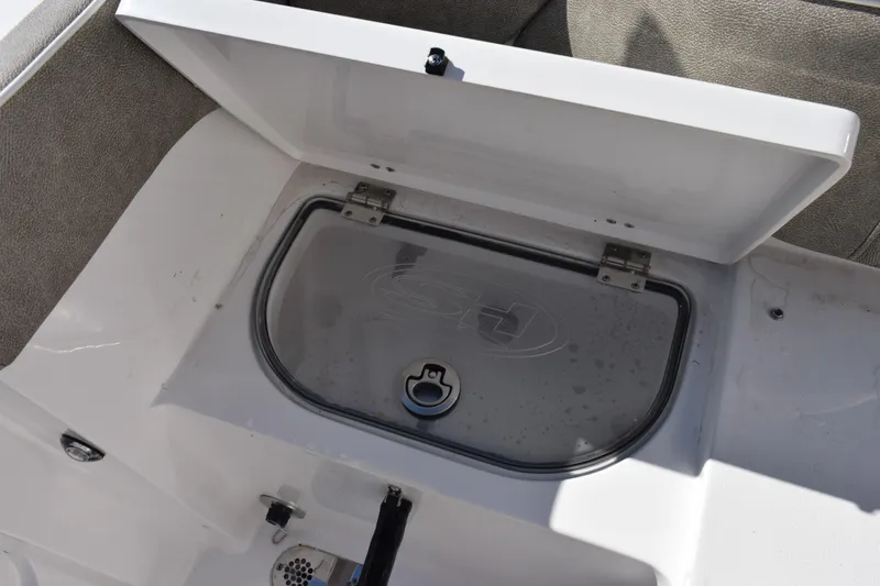 Slide: The Image of 2026 Sea Hunt Ultra 305 Coffin Box open, showcasing storage compartment. - 26