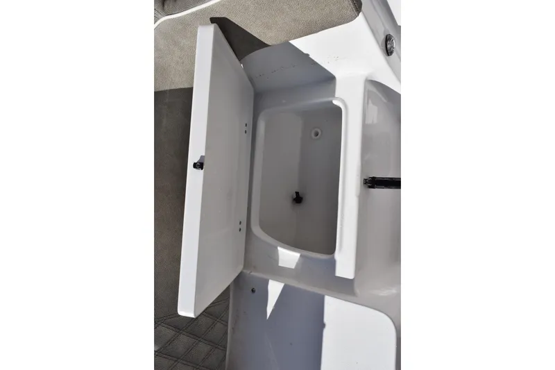 Slide: The Image of 2026 Sea Hunt Ultra 305 Coffin Box open, showcasing interior storage space. - 27