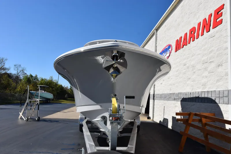 Slide: The Image of 2026 Sea Hunt Ultra 305 Coffin Box boat displayed at a marine dealership. - 3