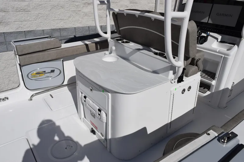 Slide: The Image of 2026 Sea Hunt Ultra 305 Coffin Box boat interior with seating and storage features. - 8