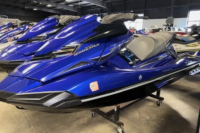 Slide: The Image of 2014 Yamaha WaveRunner FX Cruiser HO in a showroom, vibrant blue color. - 3