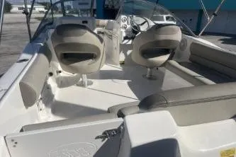 Slide: The Image of 2023 Key West 203 DFS boat interior with seating and steering console. - 6
