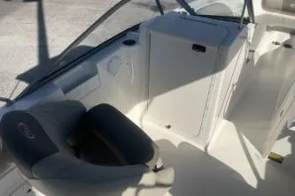 Slide: The Image of 2023 Key West 203 DFS boat interior with seating and storage compartment. - 8