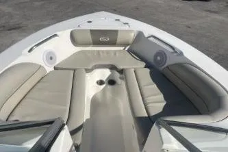 Slide: The Image of 2023 Key West 203 DFS boat interior with cushioned seating and cup holders. - 9