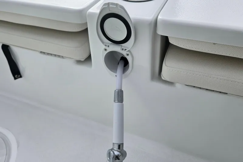 Slide: The Image of 2026 Sea Hunt BX 25 FS boat interior with hose connection detail. - 10