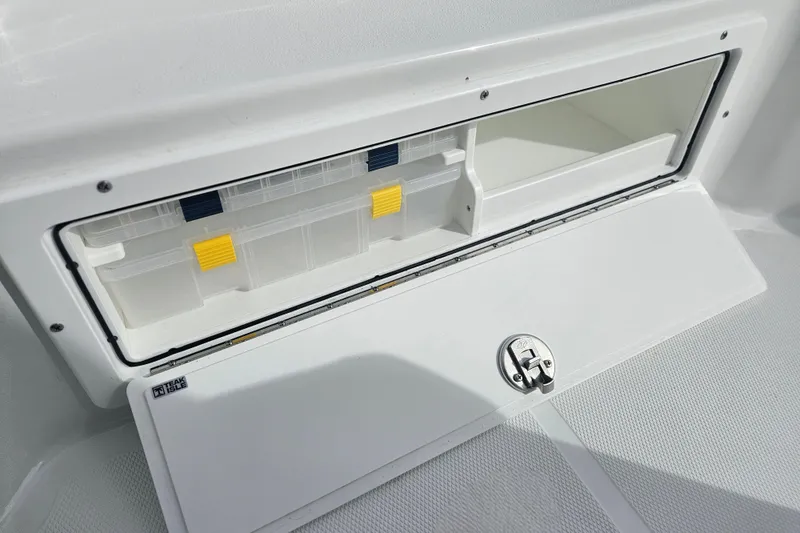 Slide: The Image of Storage compartment on 2026 Sea Hunt BX 25 FS boat, featuring organized interior space. - 21