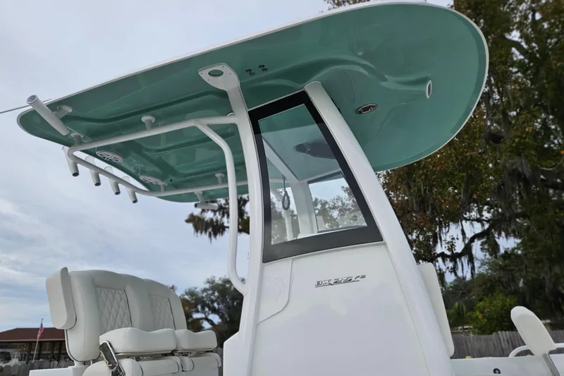 Slide: The Image of 2026 Sea Hunt BX 25 FS boat with T-top and seating, outdoor setting. - 4