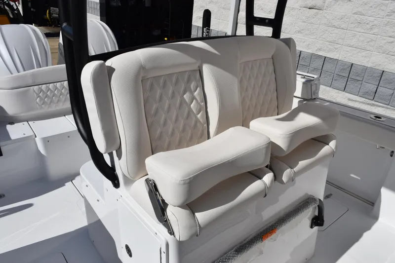 Slide: The Image of Luxurious seating on 2026 Sea Hunt Ultra 285 SE boat, featuring white cushioned seats. - 11